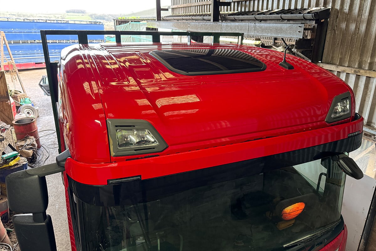 Truck cab before-wrap preparation showing surface cleaning process