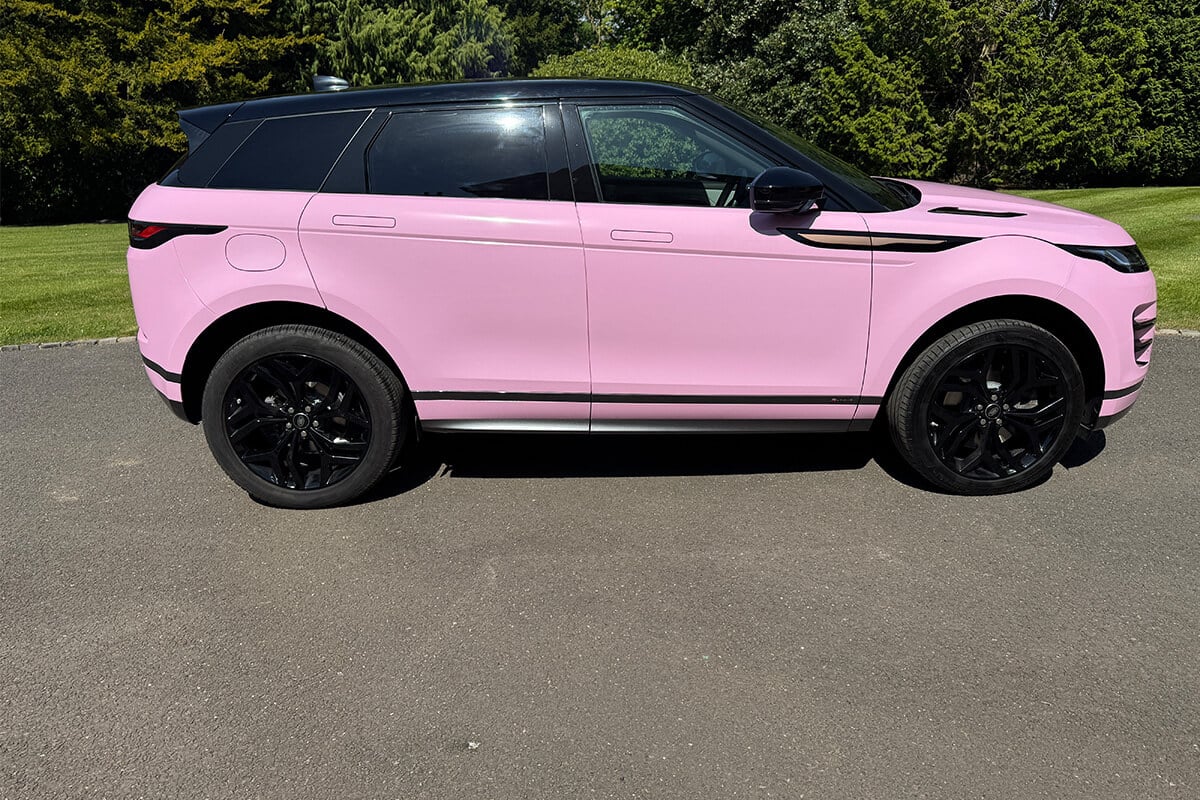 Side profile of pink Range Rover Evoque wrapped by Korok Group UK
