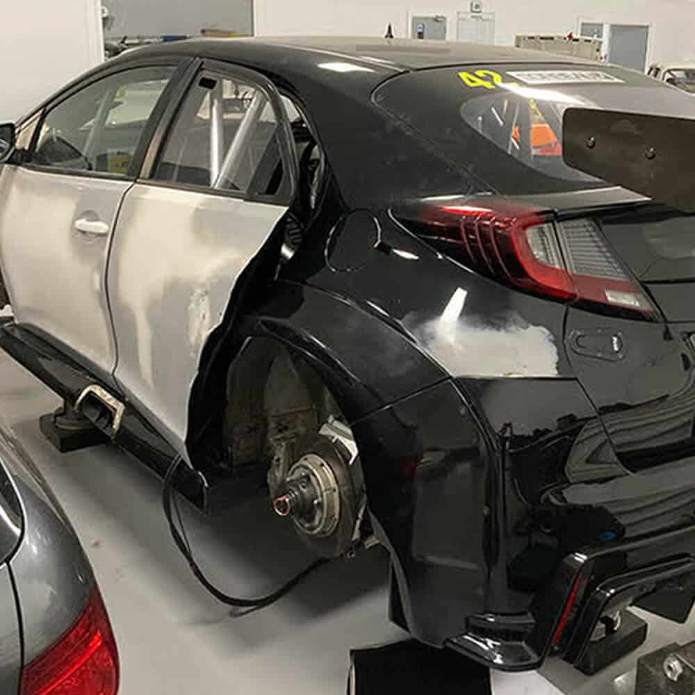 Black Honda Civic undergoing performance wrap with matte finish