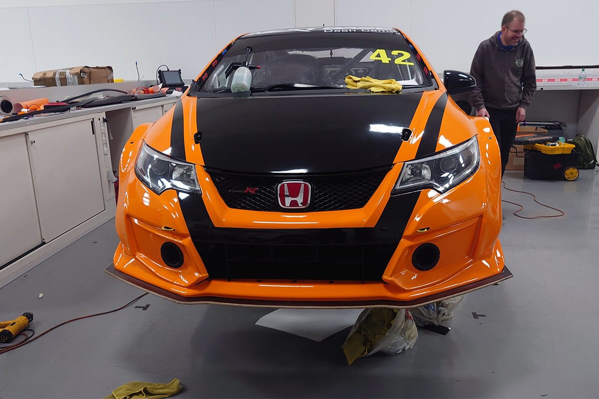 Black Honda Civic undergoing performance wrap with matte finish