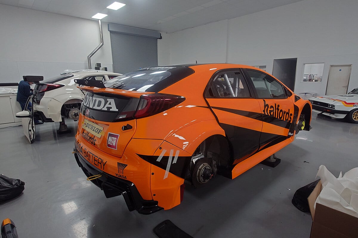 Motorsport car being wrapped for British Touring Car event sponsorship